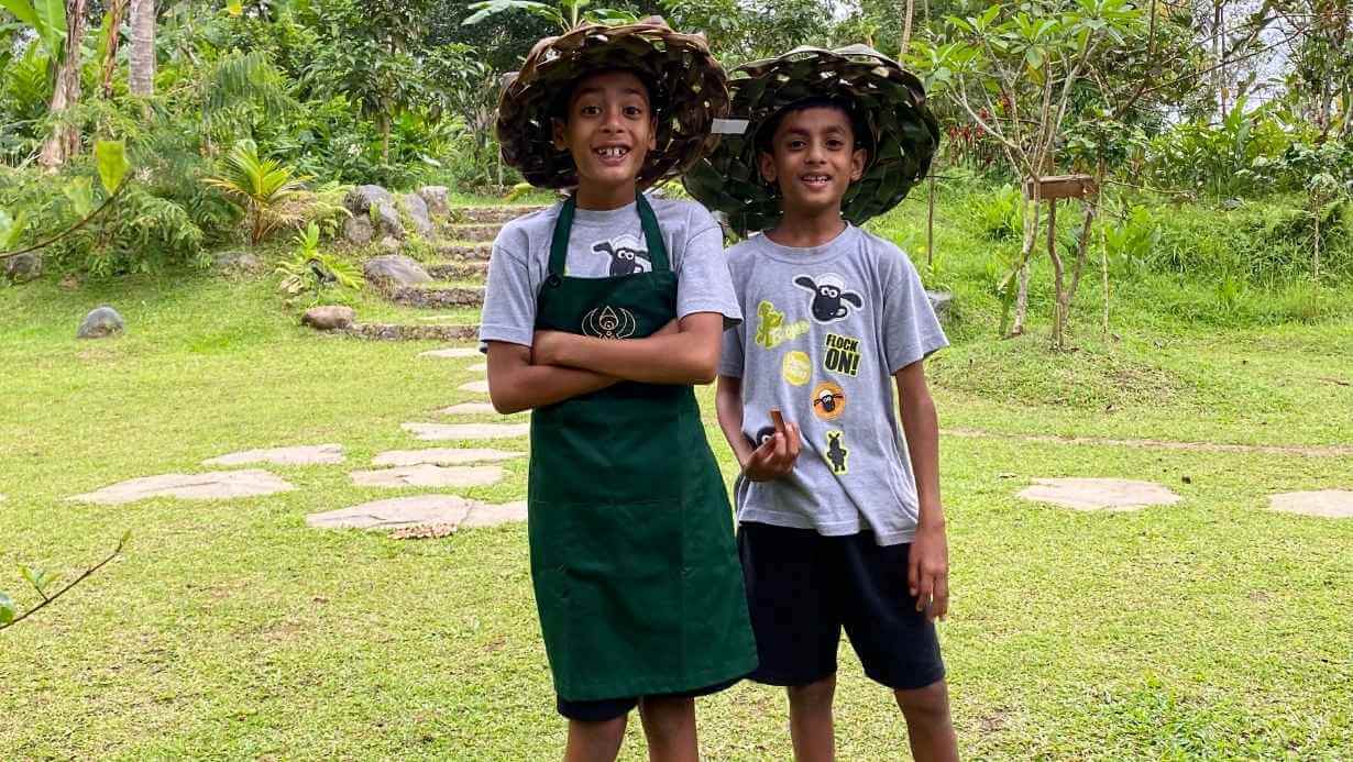 Youth, Kids & Family Cooking 1 2 kids wearing traditional hat joining farm to table cooking class in Bali